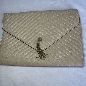 Cream bag with gold shoulder strap